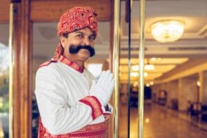 hotel staff welcoming guests at the hotel entrance