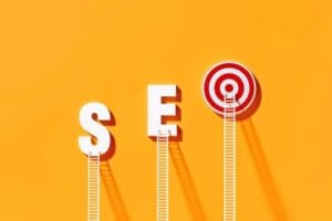 White ladders leaning on SEO written bull's eye target on yellow wall. Horizontal composition with copy space. SEO concept.